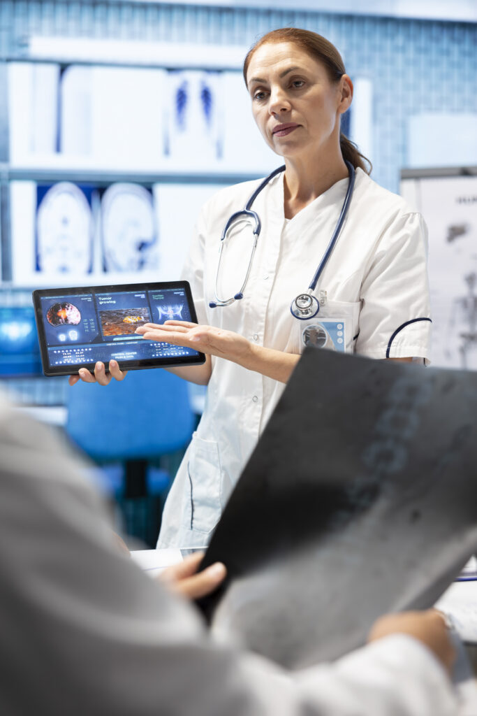 doctor neurologist showing mri brain scan results her colleagues
